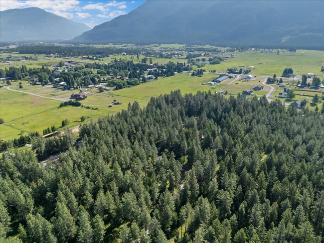 Aerial view of property's location with a mountainous background | Image 33