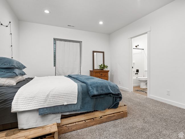 Bedroom featuring carpet flooring, recessed lighting, and ensuite bathroom | Image 45