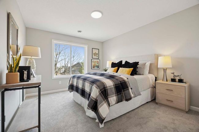 Lower level bedroom w/walk-in closet. Photos are of similar plan, & may not depict actual home plan. Configurations, features, materials & finishes may contain options that are not included in price.* | Image 24