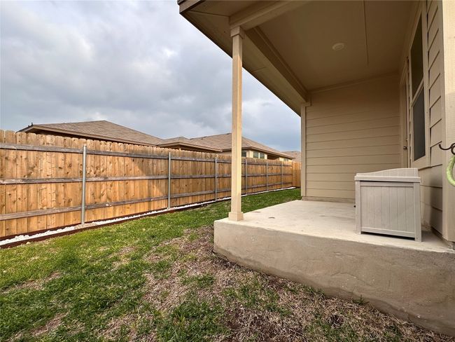 Fenced backyard featuring a patio area | Image 37