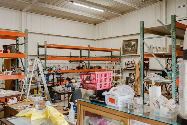 room featuring a workshop area and storage | Image 26