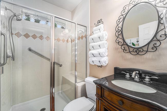 Private secondary bedroom with a standing shower. | Image 9