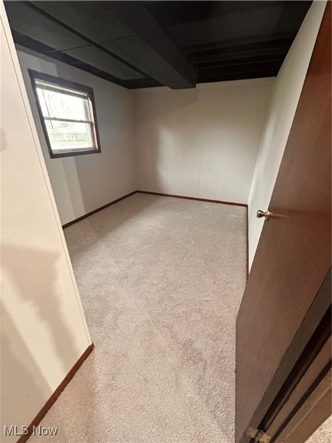 Below grade area featuring carpet flooring and baseboards | Image 18