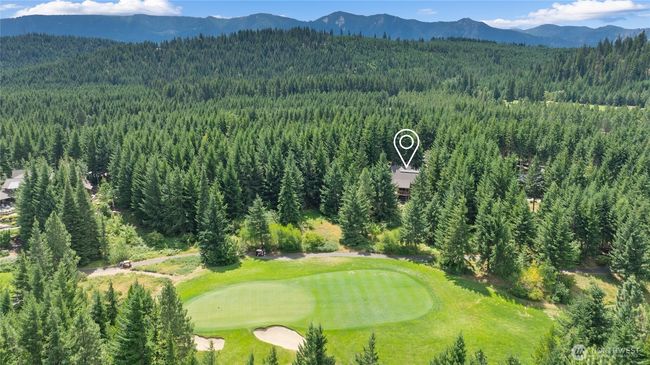 Home sits on over an acre of property on the 1st Green of the golf course. Very private but also has good views of the green. Lots of room to build or explore. | Image 6