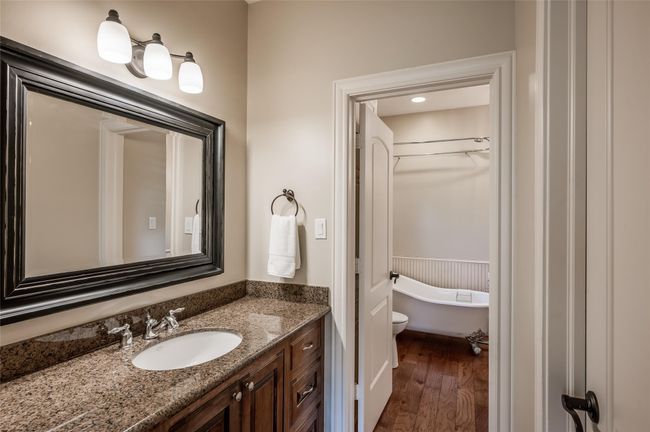 This space features a generous vanity with ample storage, a walk-in closet, and convenient access to the Jack and Jill bathroom. | Image 21