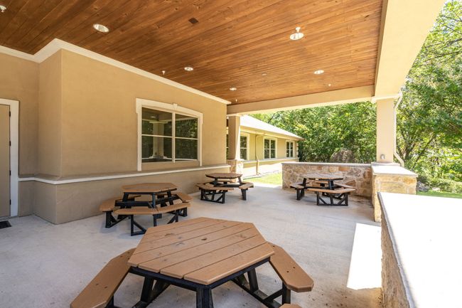 View of patio featuring outdoor dining space and exterior bar | Image 8