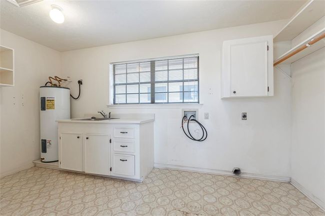 in house utility room with its own sink | Image 17