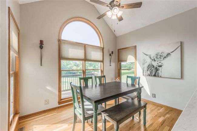 Dining space with a ceiling fan, light wood finished floors, and plenty of natural light | Image 25