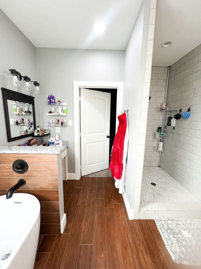 Bathroom with vanity, separate shower and tub, and hardwood / wood-style flooring | Image 11