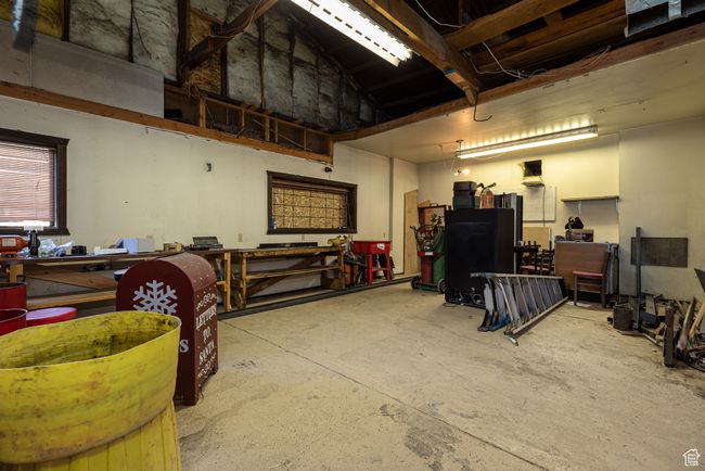 Garage featuring a workshop area | Image 30