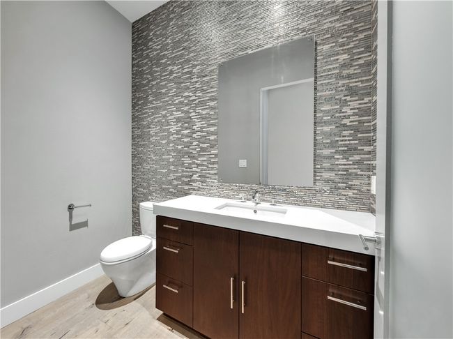 Bathroom with vanity and wood finished floors | Image 22
