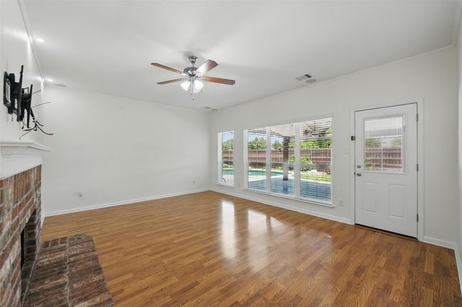 The living room also overlooks the backyard! | Image 11