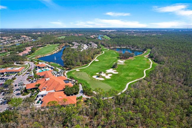 Drone / aerial view of a large body of water, a golf club, and a heavily wooded area | Image 32
