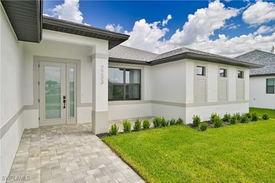 Property entrance featuring a lawn | Image 2