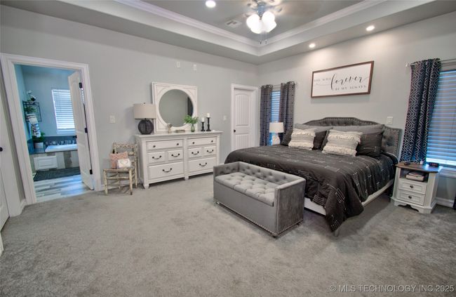 Master bedroom features a tray ceiling | Image 18