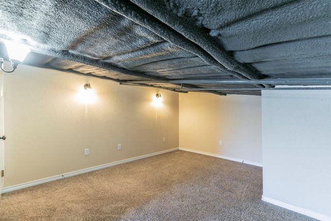 Finished basement featuring carpet flooring and baseboards | Image 21