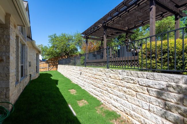 View of yard featuring a fenced backyard and a pergola | Image 22