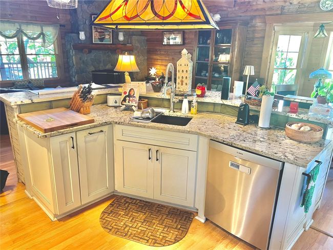 kitchen Island open to living room and dining room | Image 6