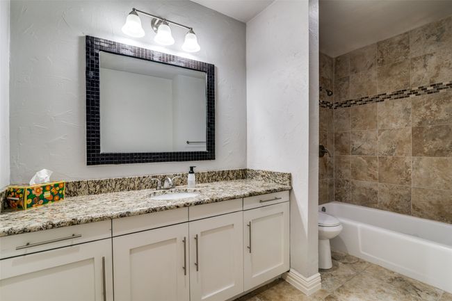 Hall bath is spacious with a large vanity. | Image 23