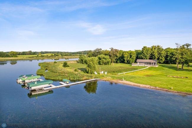 Optional HOA membership includes public swimming beach with hard sandy bottom, clubhouse access, heated pool and boat slip on Lake Lida. | Image 7