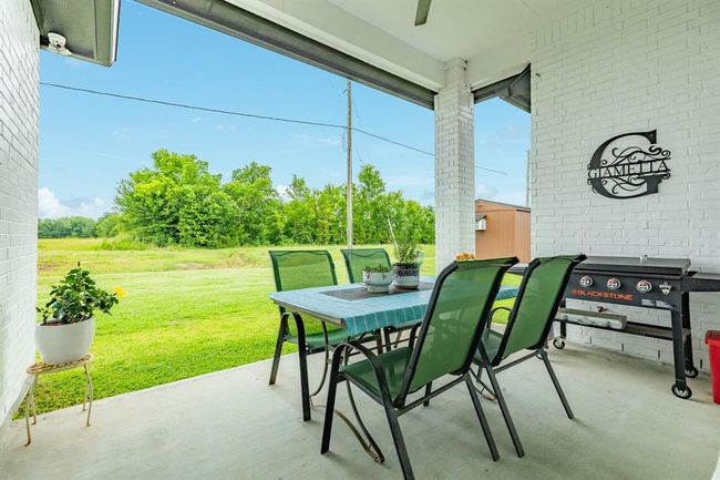 The large covered patio is perfect forentertaining family and friends. | Image 32