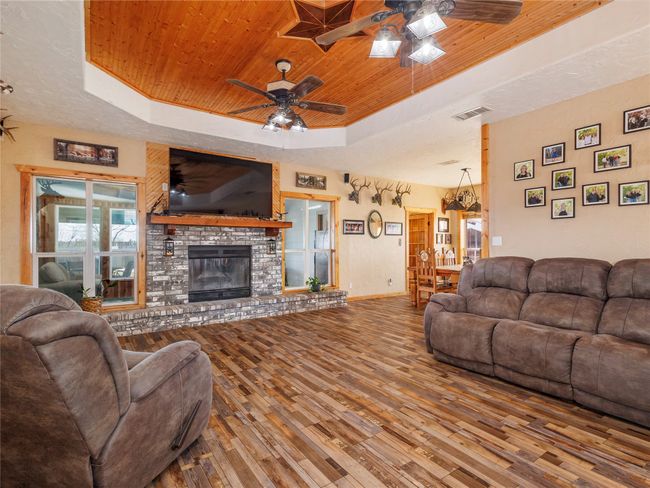 Woodburning fireplace and 10 foot ceiling | Image 5