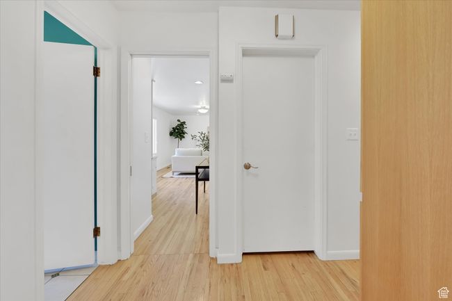 Corridor featuring light wood-style flooring and baseboards | Image 18