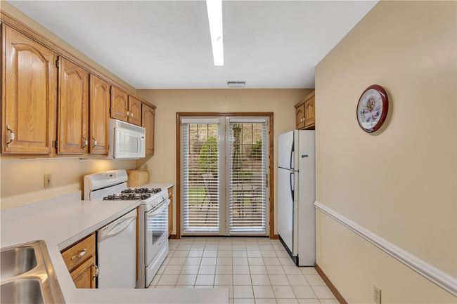 Kenmore Gas Stove, Refrigerator, and Microwave. French Door with Privacy Blinds Opens to Rear Patio. | Image 13