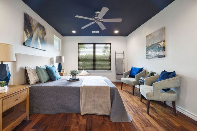 Bedroom featuring wood finished floors, recessed lighting, baseboards, and ceiling fan | Image 21