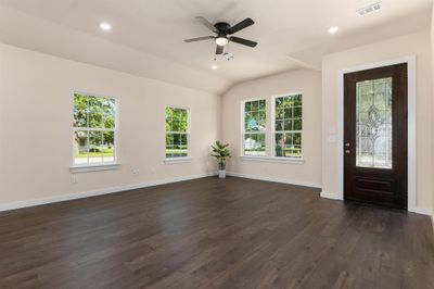 Entryway featuring dark hardwood / wood-style floors, ceiling fan, and lofted ceiling | Image 3