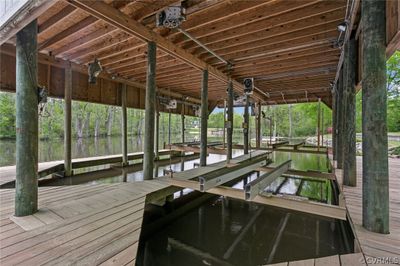 3 boat Lifts, Extensive Decking to walk around the lifts, Deep Water | Image 2