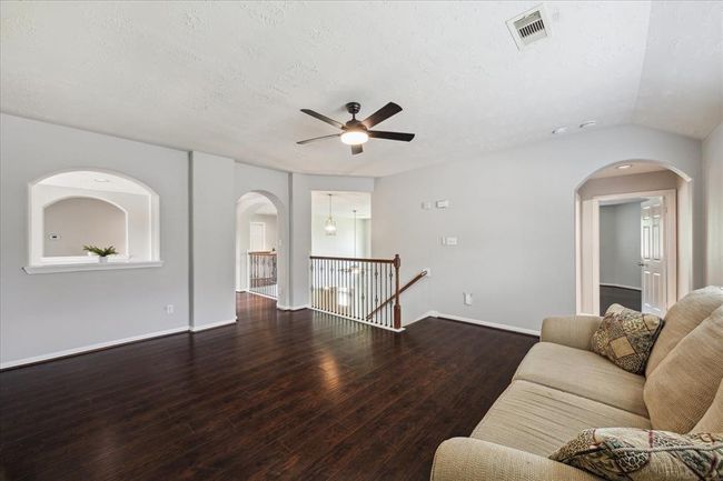 View from the game room towards the additional bedrooms. | Image 38