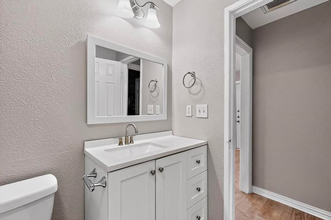 Bathroom featuring vanity and wood finished floors | Image 7
