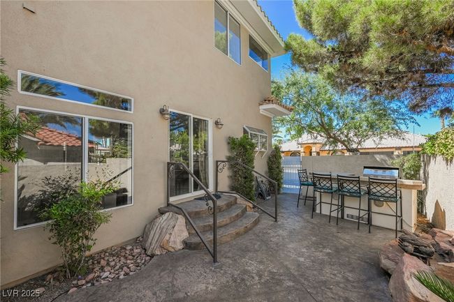 View of patio / terrace with outdoor dry bar, BBQ area and fence | Image 59