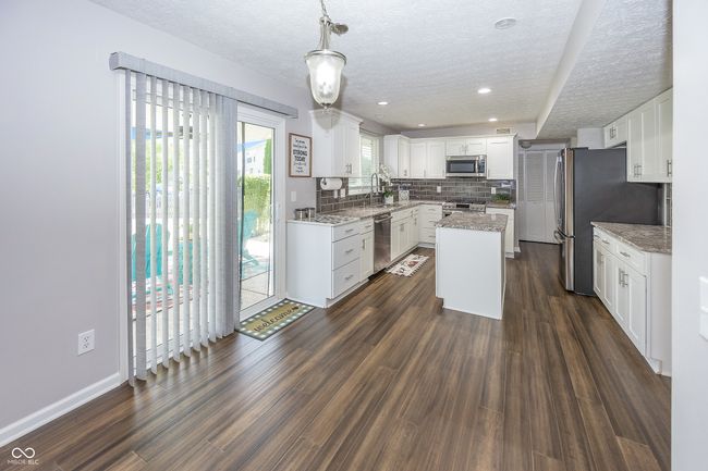 Updated white cabinetry with soft close doors/drawers & granite countertops! | Image 13