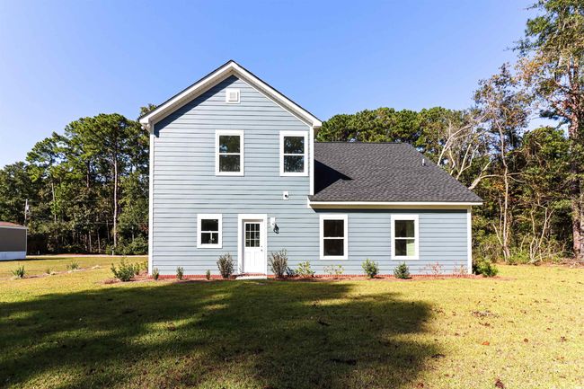 Rear view of property with a lawn | Image 23
