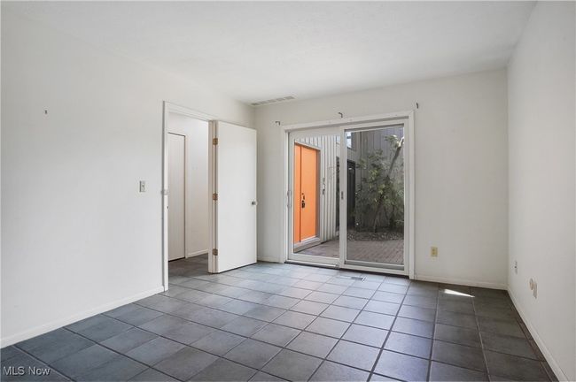 Spare room featuring baseboards, visible vents, and tile patterned flooring | Image 32