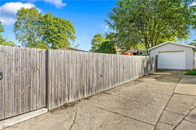 View of yard featuring an outbuilding and a garage | Image 3