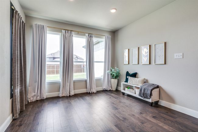 Sitting room featuring dark wood-type flooring and baseboards | Image 16