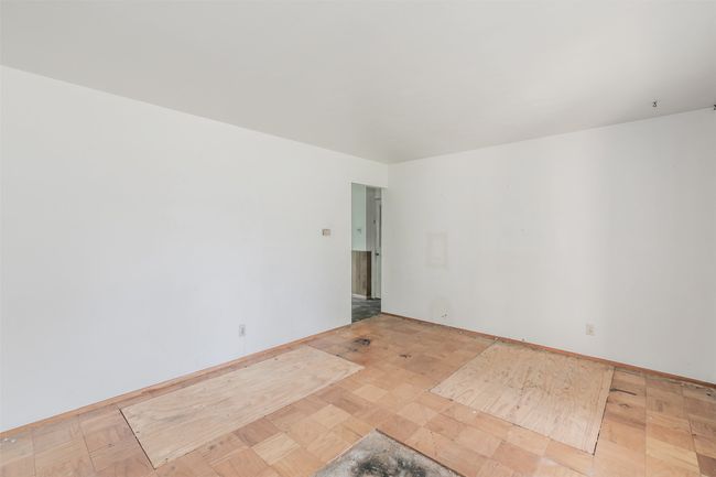 Spare room featuring baseboards | Image 11