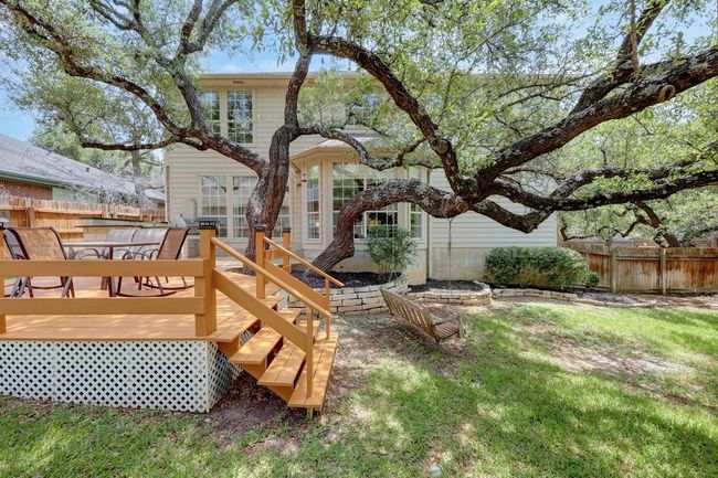 Back of house featuring fence and a wooden deck | Image 34