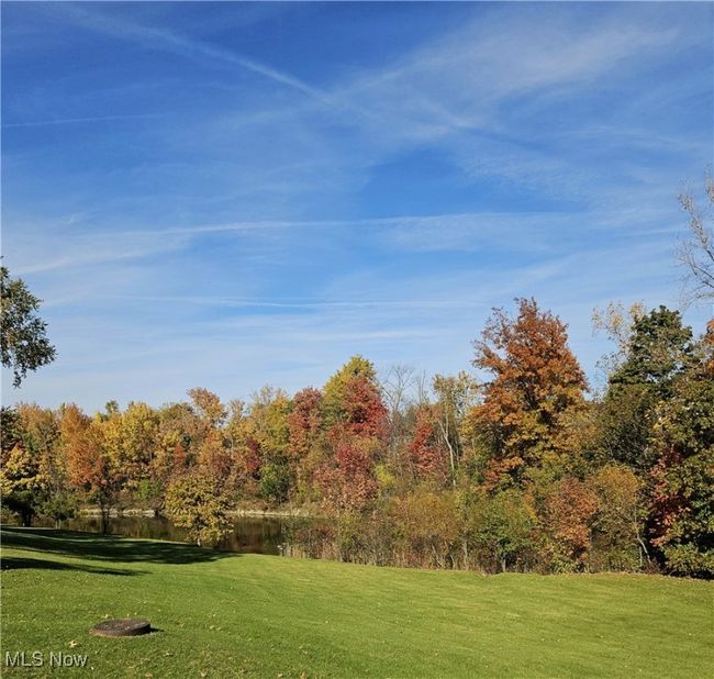 Surrounding community featuring a lawn and a water view | Image 25
