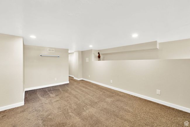Finished below grade area with baseboards, visible vents, carpet floors, and recessed lighting | Image 20