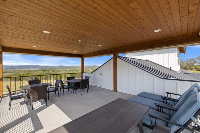 View of patio with outdoor dining space | Image 30