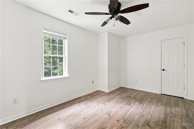 3rd bedroom with Laminate Style floors, closet and ceiling fan | Image 25