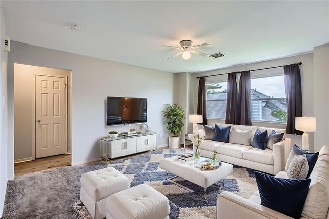 Your game room could be used as an upstairs living area, OR . . .(This picture has been virtually staged to show the potential of the space.) | Image 22