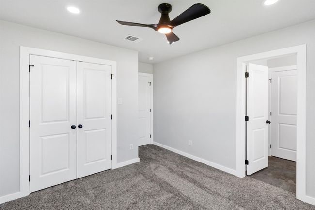 Unfurnished bedroom featuring carpet, baseboards, recessed lighting, a closet, and ceiling fan | Image 36