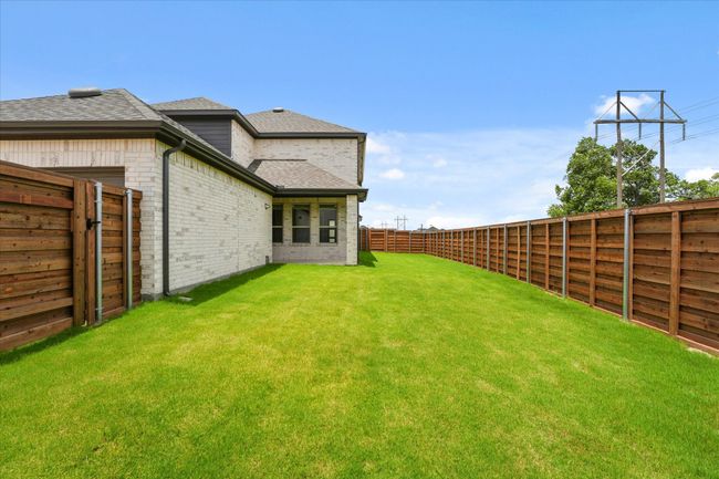 View of fenced backyard | Image 27