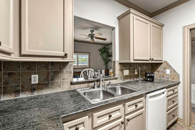 Full kitchen in the guest quarters means that this is a complete separate space for guests to live in without ever going through the main part of this home. | Image 42