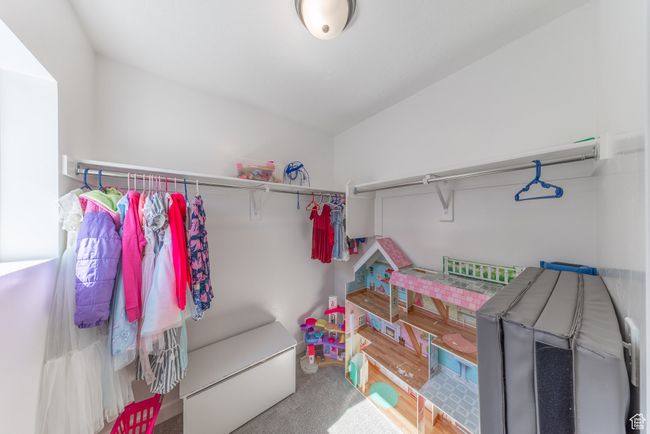 View of walk-in closet in upstairs non-master bedroom. | Image 19